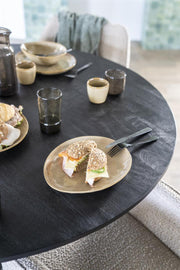 Zwarte ronde houten eettafel met fijn mangohouten blad en stijlvolle metalen poot in het midden van de tafel